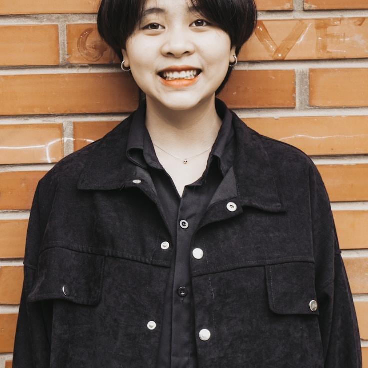 Kaveri Mehta, Lead Design Curator at GentleHarborLogic, reviewing corporate floral arrangements